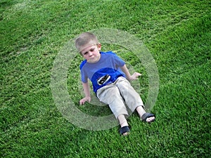 Grumpy kid in grass