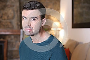 Grumpy looking man showing funny expression