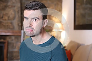 Grumpy looking man showing funny expression