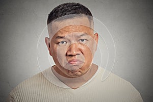 Grumpy man isolated on grey background