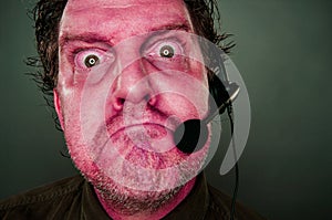 Grumpy Red Eyes and Face Customer Support Man with Headset