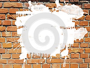 Grunge aged brick wall with white ink splatter splash drops background