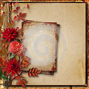 Grunge autumnal background with old card and a bouquet of dahlia