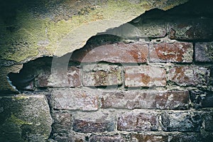 Grunge background of an old cracked brick wall. Backgrounds
