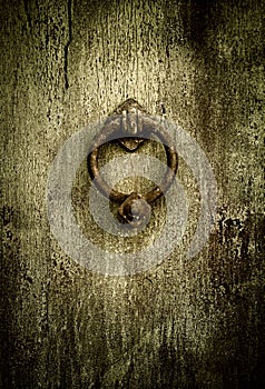 Grunge background - rusty antique door knocker