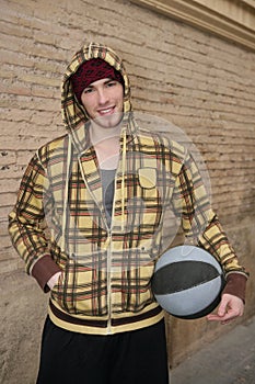 Grunge basket ball street player on brickwall photo