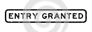 Grunge black entry granted word square rubber stamp on white background