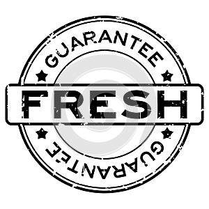 Grunge black fresh guarantee word round rubber stamp on white background