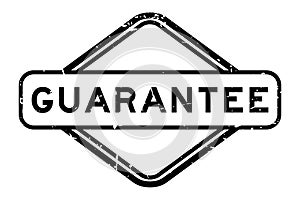 Grunge black guarantee word rubber stamp on white background