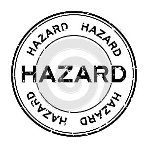 Grunge black hazard word round rubber stamp on white background