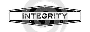 Grunge black integrity word hexagon rubber stamp on white background