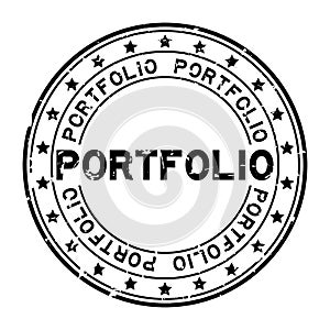 Grunge black portfolio word with star icon round rubber stamp on white background