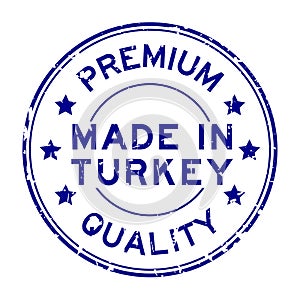 Grunge blue premium quality made in Turkey round rubber stamp on white background