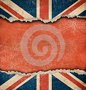 Grunge British flag on ripped paper with big copyspace