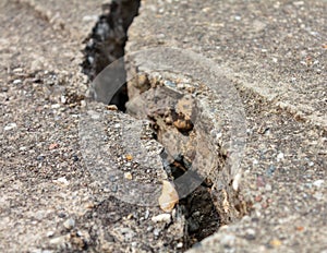 Grunge concrete cement wall with crack in industrial building