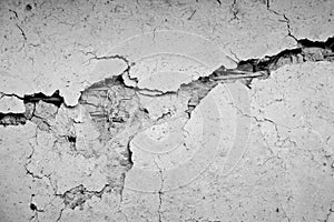 Grunge concrete cement wall with crack in industrial building.