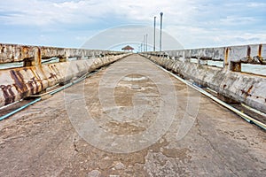 Grunge concrete pier at Thung Wua Laen beach