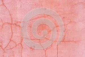 Grunge crack orange or pink color concrete wall textured background as loft style