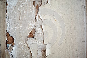 Grunge cracked and broken plaster wall background texture