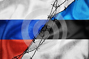 Grunge flags of Russian Federation and Estonia divided by barb wire illustration