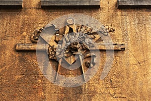 Grunge freemasonry emblem on a dramatic background - masonic triangle and compass, closeup of old architectural building