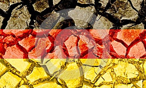 Grunge Germany flag isolated on dry cracked ground background