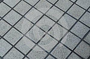 Grunge gray ceramic tile floor