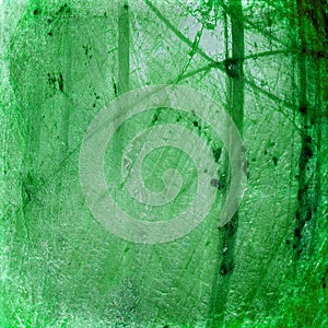 Grunge green luminous cracked abstract background