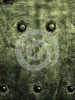 Grunge green metal plate rivets screws background texture