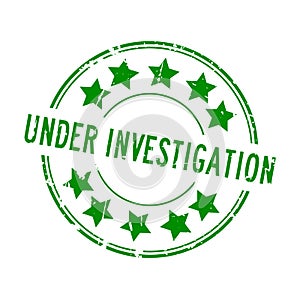 Grunge green under investigation word with star icon rubber stamp on white background