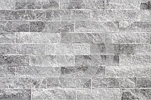 Grunge grey stone wall tiles texture.Wall natural grey stone dirty,dust.Wall and panel marble natural pattern for architecture and