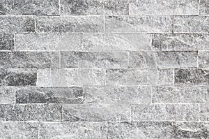 Grunge grey stone wall tiles texture.Wall natural grey stone dirty,dust.Wall and panel marble natural pattern for architecture and