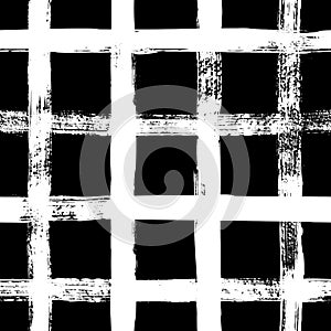 Grunge grid seamless pattern. Abstract plaid texture hand drawn with a ink brush strokes. Vector Monochrome background