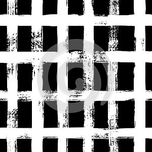 Grunge grid seamless pattern. Abstract plaid texture hand drawn with a ink brush strokes. Vector Monochrome background