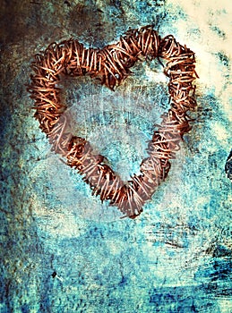 Grunge heart on blue wall