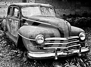 Grunge and hight rusty old car. Black-white photo photo