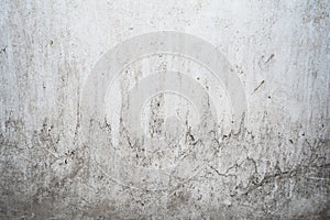 Grunge light gray texture of an old wall with black divorces, white surface with smudges, abstract background