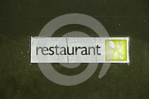 Grunge metal surface texture background with restaurant sign