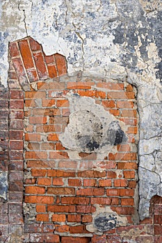 Grunge old red brick and plaster wall texture