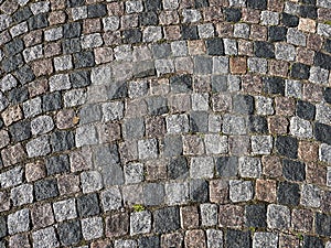 Grunge old stone cobbles as a background photo