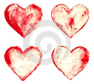 Grunge painted red heart shapes set