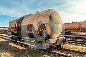 Grunge petroleum waggon on the railroad