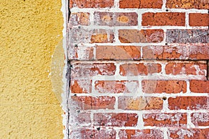 Grunge red brick yellow concrete wall background texture