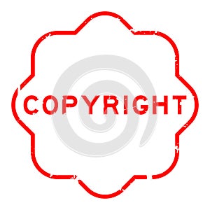Grunge red copyright word rubber stamp on white background