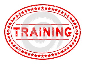 Grunge red training word oval rubber seal stamp on white background