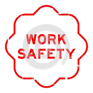 Grunge red work safety word rubber stamp on white ckground