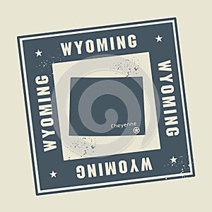 Grunge rubber stamp with name and map of Wyoming, USA