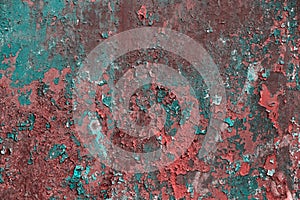Grunge rusted metal texture, covered with old colored paint, rust and oxidized metal background