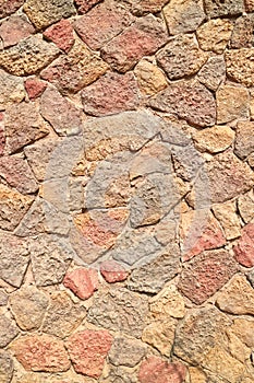 Grunge stone brick wall pattern of exterior building.