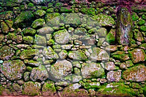 Grunge stone wall with irregular pattern